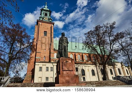 Statue and cathedral church in Gniezno Poland