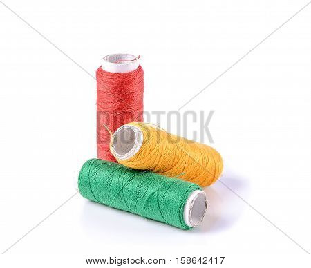 Colorful spools of thread on a white background. Colored thread for sewing