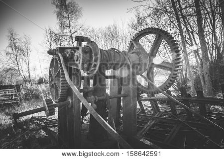 old maintenance machine rotting away in the woods