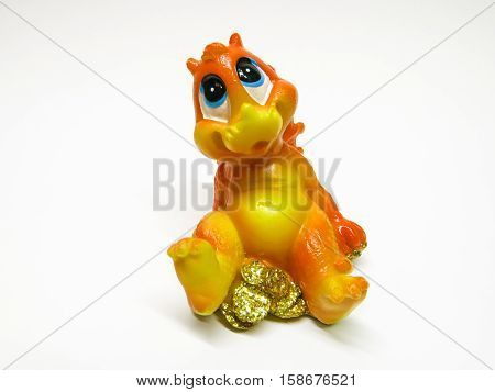 small statuette of small dragon isolated background