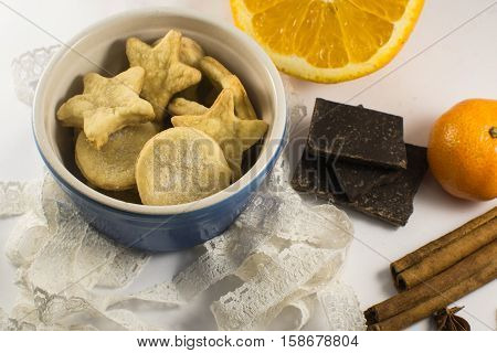 biscuits spices and chocolade on the white backgraund