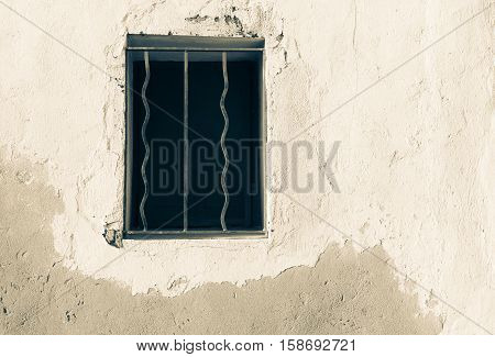 Window opening with security bars in wall