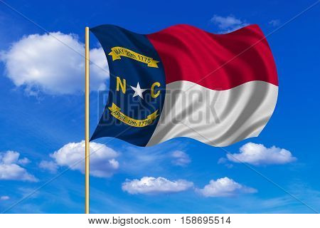 Flag of the US state of North Carolina. American patriotic element. USA banner. United States of America symbol. North Carolinian official flag waving in the wind blue sky background. Fabric texture. 3D rendered illustration