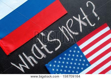 What's next  hand writing chalk text on black chalkboard