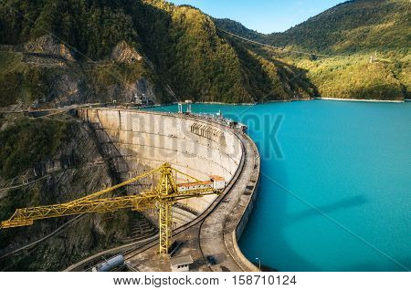 The Enguri hydroelectric power station HES. The Jvari Reservoir next to Inguri Dam surrounded by mountains Upper Svaneti Georgia. Second highest concrete arch dam in the world. Jvari location.