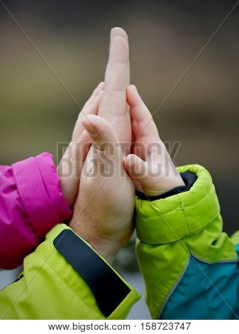 Hans of father and his children. Boy and girl.