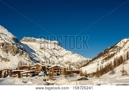 Alpine winter mountain landscape. French Alps covered with snow in sunny day. Val-d'Isere, France