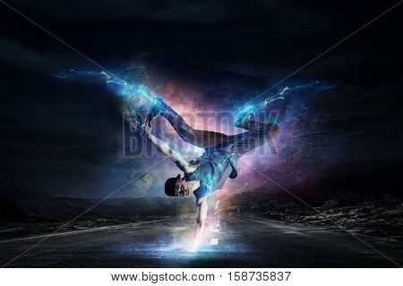 B-boy performing some moves . Mixed media