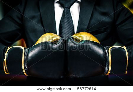 Businessman With Boxing Gloves Is Ready For Corporate Battle.