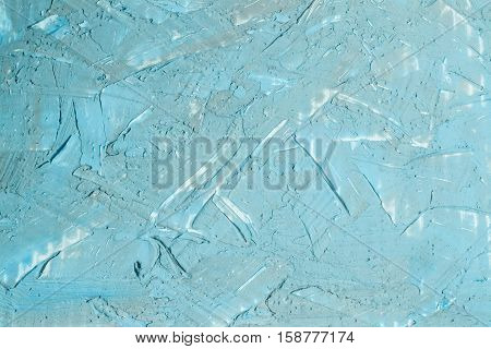 Abstract textured background: mixture of blue gray and white putty. Uneven strokes rough texture of a wall pattern