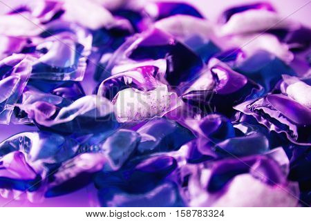 Gel capsules with laundry detergent close up