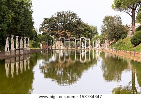 Statue with reflection at the hadrian villa, adriana is a large roman archaeological complex at tivoli, Italy
