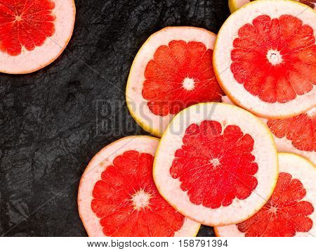 Texture of a ripe grapefruit slice, closeup