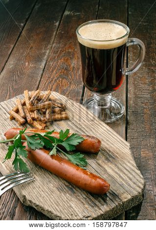 Grilled Sausages With Beer On Wood Plate