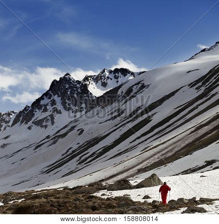 Hiker at snowy mountains in sun evening. Turkey Kachkar Mountains in spring (highest part of Pontic Mountains).