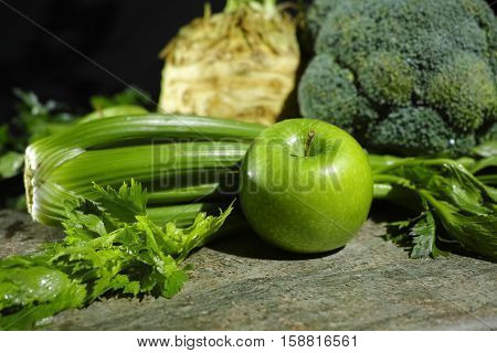 Green vegetables and fruits - celery apples celery root celeriac broccoli healthy diet concept