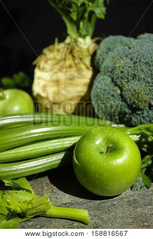 Green vegetables and fruits - celery apples celery root celeriac broccoli healthy diet concept