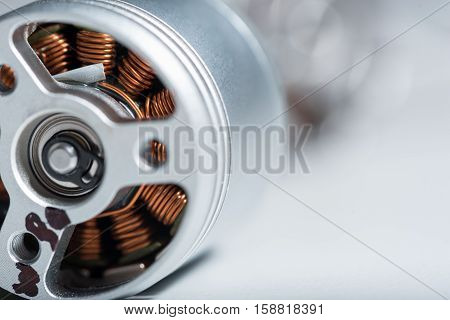 Working detail. Close up of copper motor armature as a part of a drone.