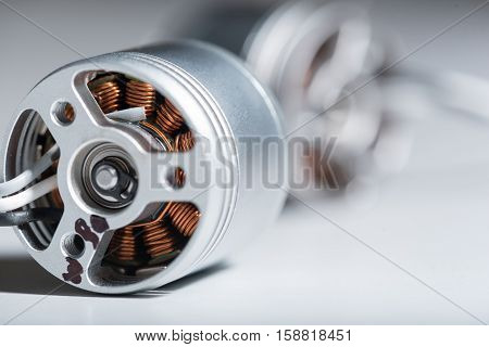 Era of technologies. Close up of two metal motor armatures as details of drone.