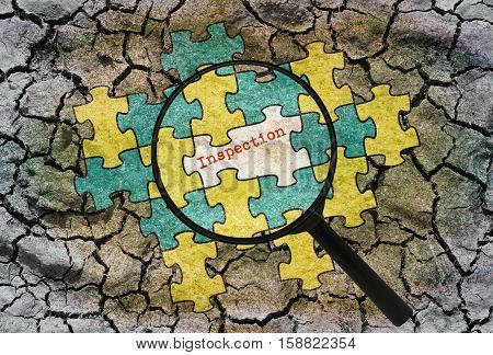 Word Inspection written under a magnifier on abstract background