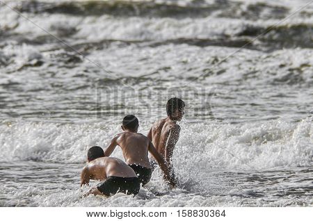 Beach boys. Sea shore. Waves. Azerbaijan. Novkhani