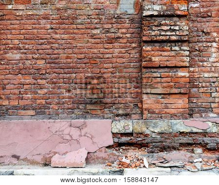 Broken old Bricklaying wall Fragment From red bricks and damaged plaster for Background