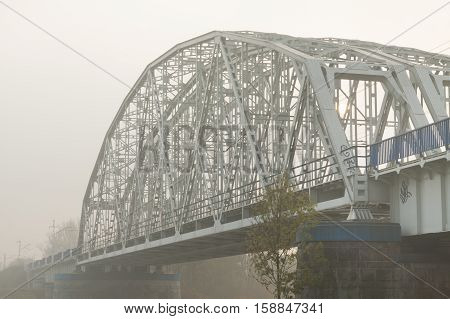 Poland Krakow Steel Railway Bridge over Vistula river afternoon sunlit