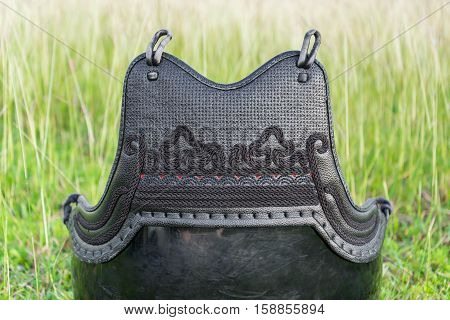 Used and Dirty Kendo Body Armour Protective or DO in grass field.