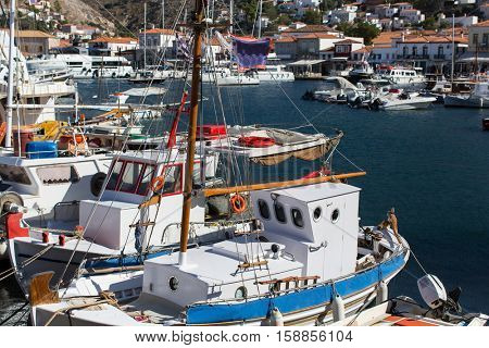 Old fishing boats in the harbour of Hydra island, Aegean sea, Greece.