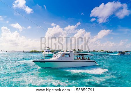 MALE, MALDIVES - October 04 :  Boats at the harbor next to Ibrahim Nasir International Airport in Male, Maldives.