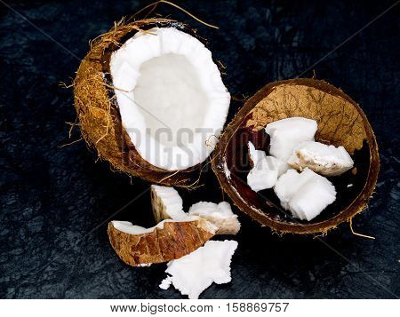 The coconut  on the color of the stone table and dark background
