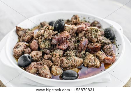pica pau portuguese spicy sauce pork and sausage traditional tapas snack