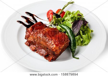 roasted pork ribs on a white plare