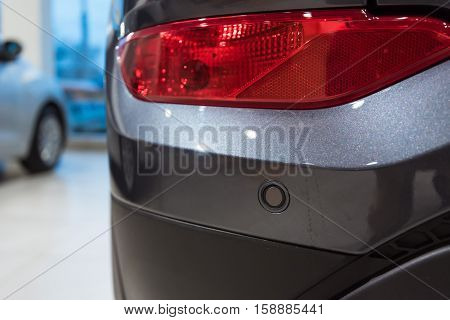 Closeup photograph of parking sensors on a modern car