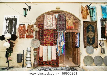  Souvenir shop in Icheri Sheher (Old Town) of Baku, Azerbaijan. Typical tourist shop with souvenirs and antiques.