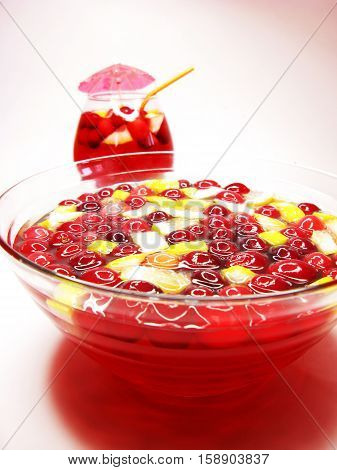 fruit cruchon cocktail punch in bowl with ice and fruit