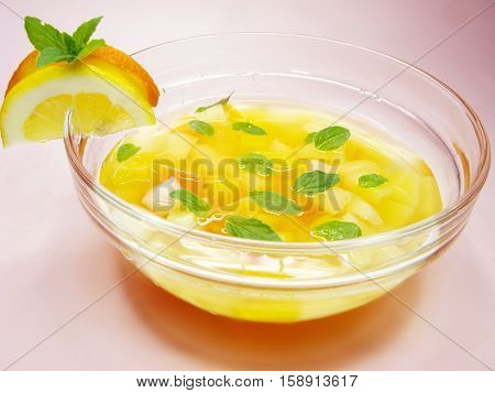 fruit cruchon cocktail punch in bowl with ice and fruit