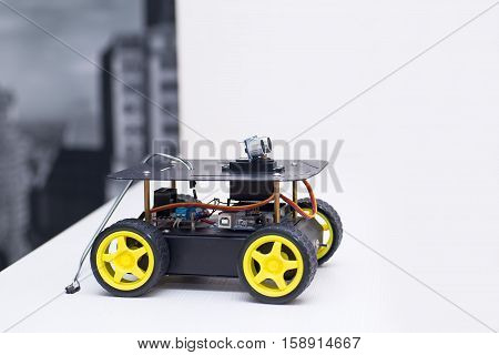robot on the wheels with yellow wheels robot