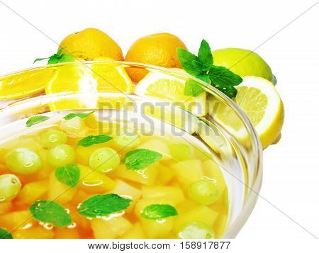 fruit cruchon cocktail punch in bowl with ice and fruit