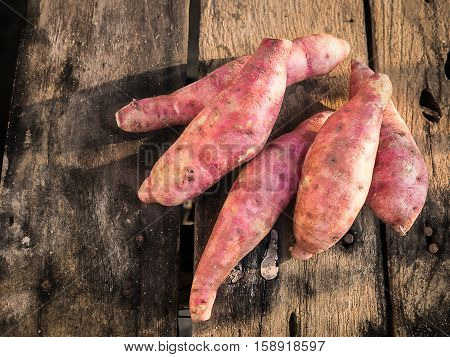 still life sweet potato on table wood.