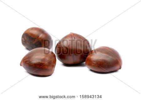 Fresh brown chestnuts isolated on white background