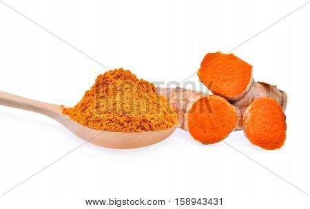 turmeric root and powder in wooden spoon isolated on white background