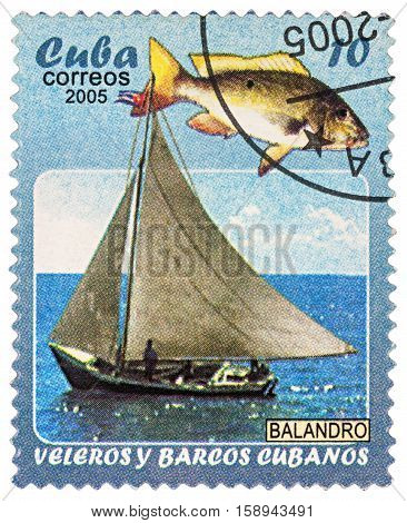 MOSCOW RUSSIA - NOVEMBER 29 2016: A stamp printed in Cuba shows yacht and fish series 
