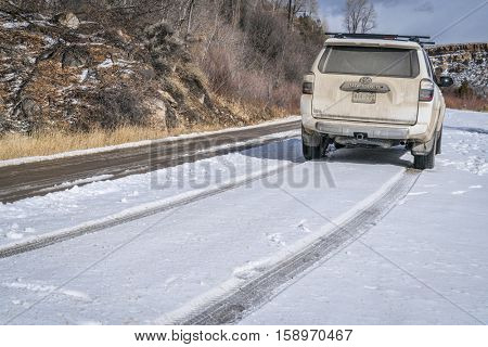 BURNS, CO, USA - NOVEMBER 27, 2016:  Winter travel on a dirt road along Colorado River with Toyota 4Runner SUV (2016 Trail edition).