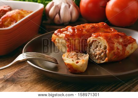 Stuffed cabbage leaves with minced meat and rice in tomato sauce.