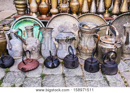 Old oriental antiques barass jungs and vases on street market in Baku, Azerbeijan.