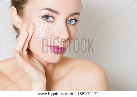 Closeup of female adult with marks on skin for cosmetic medical procedures