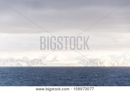Antarctica in a cloudy day- Antarctic Peninsula - Palmer Archipelago - Neumayer Channel - Global warming - Fairytale landscape
