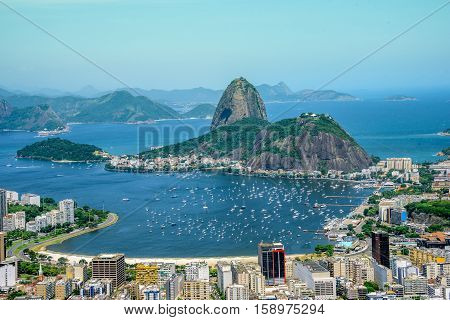 View from the bird's eye view on the Sugarloaf mountain, Botafogo bay with white sailing yachts and city landscape, Rio de Janeiro, Brazil