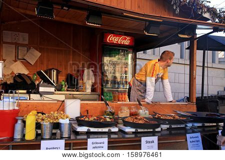 PRAGUE, CZECH REPUBLIC - SEPTEMBER 28, 2015: Wooden stalls with traditional street food in Prague Castle (Hradchany), Prague, Czech Republic.